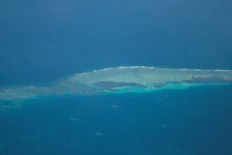Philippines says ‘we have not lost’ South China Sea reef after pullout