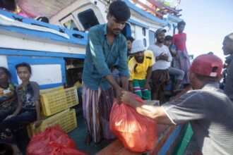 About 140 Rohingya Muslims on wooden boat off Indonesia’s coast as residents refuse to let them land