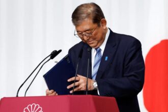 Japan PM vows to stay on despite election debacle