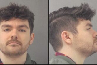 Far-right influencer Nick Fuentes charged with battery, posts own mugshot on social media