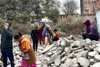 People run out of buildings as walls collapse